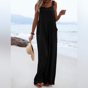 Adjustable strap wide leg bib overall jumpsuit with pockets.